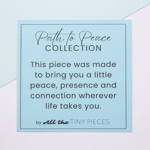 Text on a light blue background for 'Path to Peace Collection' by 'All the Tiny Pieces'.