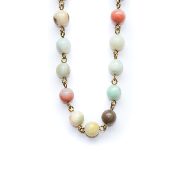 Necklace with pastel-colored amazonite beads on a white background