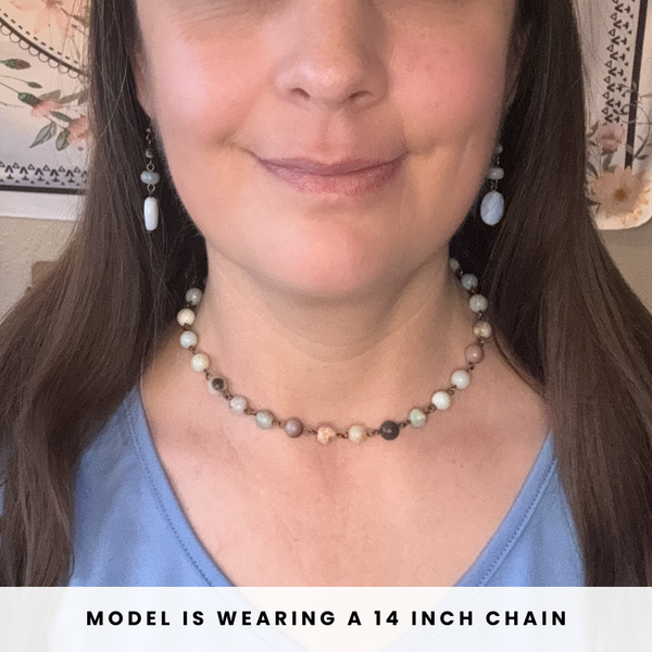 Person wearing an amazonite beaded necklace with text indicating chain length