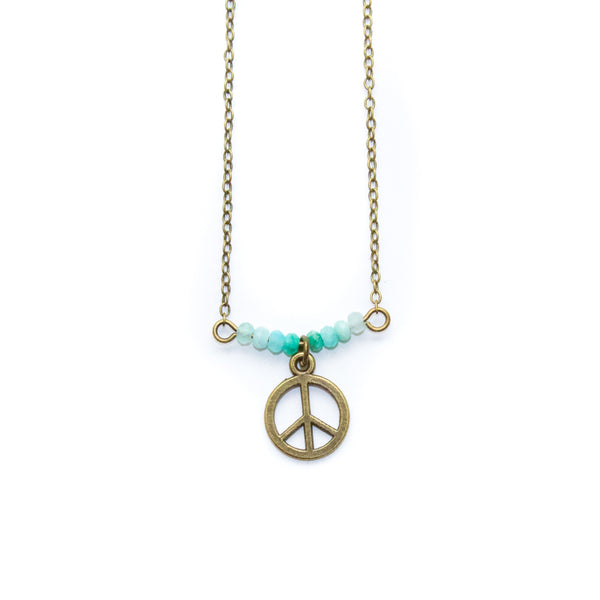 Necklace with peace symbol pendant and amazonite beads on a white background