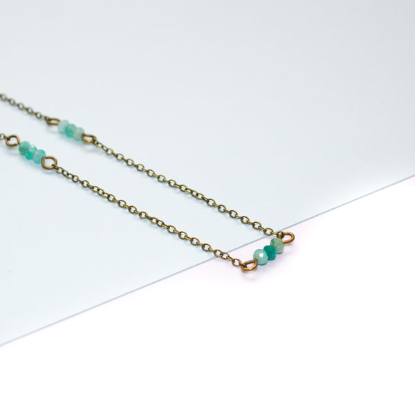 Necklace with amazonite beads on a white background