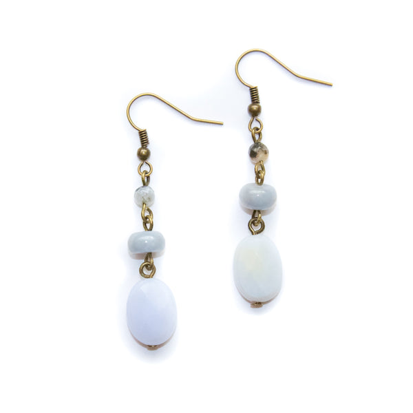 Pair of earrings with white blue lace agate beads on a white background