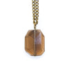 Necklace with a faceted smoky quartz pendant on a white background