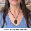 Person wearing a smoky quartz necklace with a pendant, text indicating chain length.