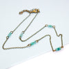 Necklace with amazonite beads and gold chain on a white background