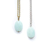 Two necklaces with light blue amazonite pendant beads on a white background