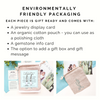Text detailing environmentally friendly packaging with jewelry display card, organic cotton pouch, gemstone info card, and gift box option.