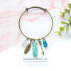 Wandering Charms and Gems Bangle Bracelet